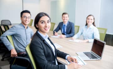 smiling business lady working with colleagues